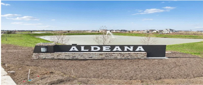 Aldeana Texas MUD district sign near a pond with suburban homes, illustrating MUD financing solutions and water district f...