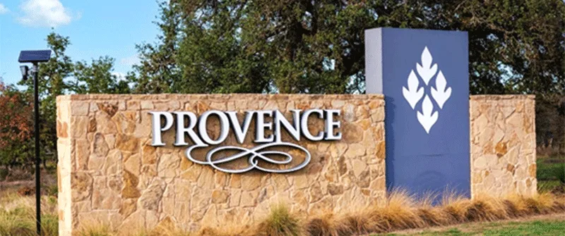 Provence Texas MUD financing sign with stone wall and blue logo, representing MUD district funding solutions and water dis...